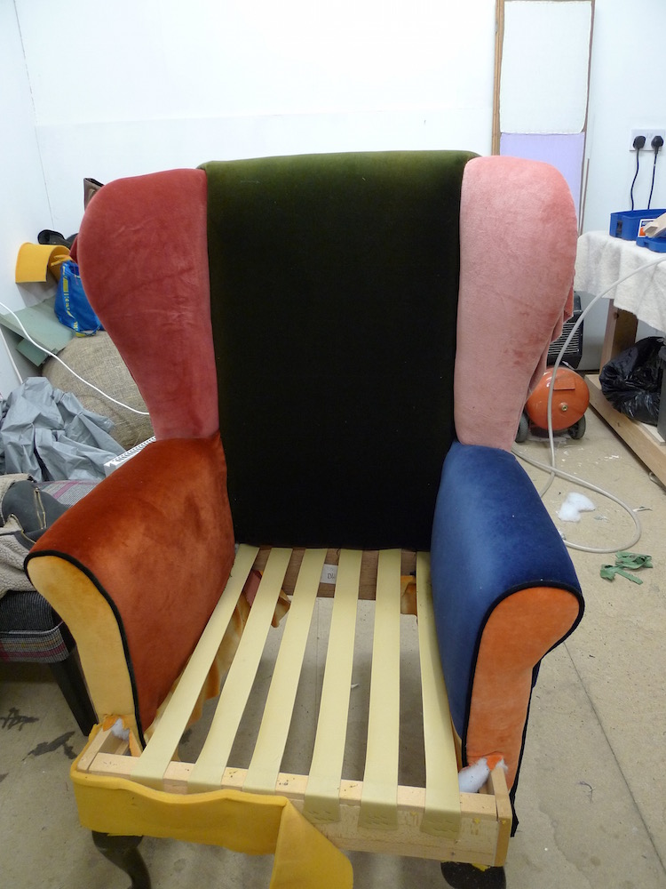reupholstered velvet wingback chair in progress